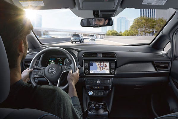 Man driving in Nissan EV