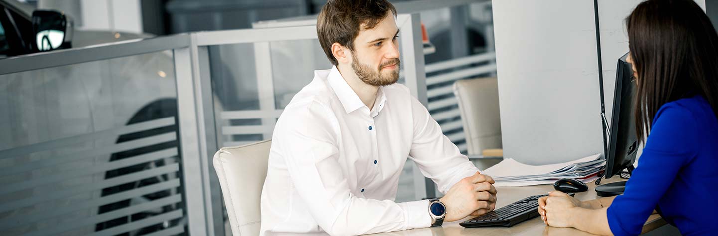image of a man sitting at a desk