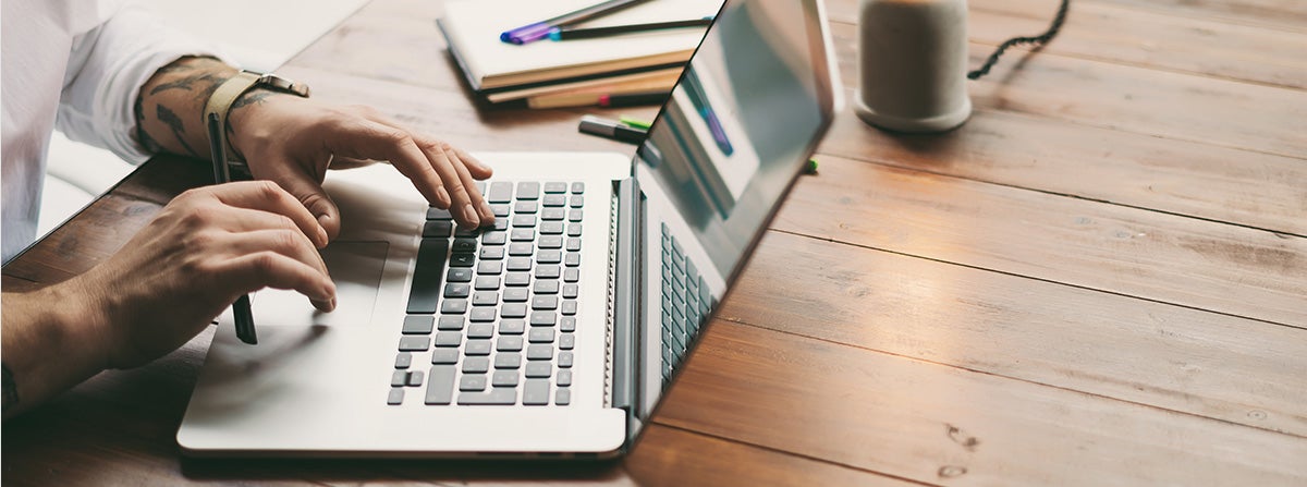 image of a person on a laptop